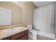 Clean bathroom with tub shower, toilet and vanity at 7710 Silver Moon Way, Indianapolis, IN 46259