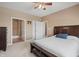 Spacious bedroom with ceiling fan and ensuite bathroom at 7710 Silver Moon Way, Indianapolis, IN 46259