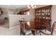 Spacious dining area with a large table, hutch, and hardwood floors at 7710 Silver Moon Way, Indianapolis, IN 46259