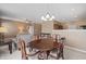 Bright dining room features a wood table with chairs and built-in hutch at 7710 Silver Moon Way, Indianapolis, IN 46259