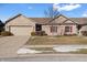 Brick ranch home with attached garage and landscaped lawn at 7710 Silver Moon Way, Indianapolis, IN 46259