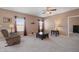 Living room with large windows and comfortable furniture at 7710 Silver Moon Way, Indianapolis, IN 46259