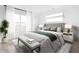 Bright bedroom with plush bedding and large window at 9891 Sunbranch Dr, Carmel, IN 46290