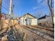 Backyard with detached garage and gravel area at 1014 N Sheffield Ave, Indianapolis, IN 46222