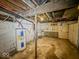 Unfinished basement with water heater and exposed utilities at 1014 N Sheffield Ave, Indianapolis, IN 46222