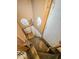 Unfinished basement with exposed pipes and a wooden staircase at 1014 N Sheffield Ave, Indianapolis, IN 46222