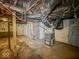 Unfinished basement with HVAC unit and exposed utilities at 1014 N Sheffield Ave, Indianapolis, IN 46222