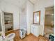 Small bathroom with a tub, toilet, and vanity at 1014 N Sheffield Ave, Indianapolis, IN 46222