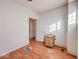 Bright bedroom with hardwood floors and window at 1014 N Sheffield Ave, Indianapolis, IN 46222