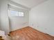 Charming bedroom with hardwood floors and a window at 1014 N Sheffield Ave, Indianapolis, IN 46222