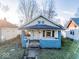Quaint blue house with front porch and small yard at 1014 N Sheffield Ave, Indianapolis, IN 46222