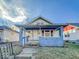 Blue house with a front porch, steps, and small yard at 1014 N Sheffield Ave, Indianapolis, IN 46222