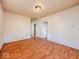 Light-filled living room with hardwood floors and doors to other rooms at 1014 N Sheffield Ave, Indianapolis, IN 46222