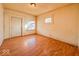 Living room with hardwood floors, window and door at 1014 N Sheffield Ave, Indianapolis, IN 46222