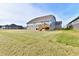 Spacious backyard with grassy lawn and wooden deck at 11722 Platt St, Noblesville, IN 46060