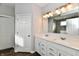 Double vanity bathroom with white cabinets and mirror at 11722 Platt St, Noblesville, IN 46060