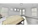 Bright bedroom with large windows, wood-look floors, and ample natural light at 11722 Platt St, Noblesville, IN 46060