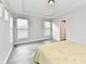 Primary bedroom with wood-look floors and multiple windows at 11722 Platt St, Noblesville, IN 46060