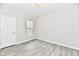 Spacious bedroom with wood-look floors and large window at 11722 Platt St, Noblesville, IN 46060