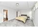 Primary bedroom with wood-look floors and access to other rooms at 11722 Platt St, Noblesville, IN 46060