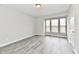Bedroom with bay window, wood-look floors, and neutral walls at 11722 Platt St, Noblesville, IN 46060