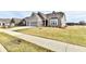 Two-story home with gray brick exterior and a three-car garage at 11722 Platt St, Noblesville, IN 46060