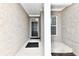 Inviting front entry with brick facade, black door, and sidelights at 11722 Platt St, Noblesville, IN 46060
