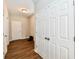 Hallway with double door closet and wood-look floors at 11722 Platt St, Noblesville, IN 46060