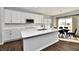 Modern kitchen with white cabinets, quartz countertops, and island at 11722 Platt St, Noblesville, IN 46060
