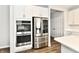 Modern kitchen with stainless steel appliances and white cabinets at 11722 Platt St, Noblesville, IN 46060