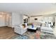 Spacious living room with large sectional sofa, coffee table, and hardwood floors at 11722 Platt St, Noblesville, IN 46060