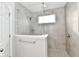 Modern shower with glass enclosure and gray tile at 11722 Platt St, Noblesville, IN 46060