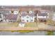Aerial view of a home with a shed and a yard that backs up to a pond at 1229 Tealpoint Cir, Indianapolis, IN 46229