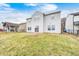 A house backyard with a concrete patio and lawn at 1229 Tealpoint Cir, Indianapolis, IN 46229