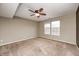 Spacious bedroom with neutral carpet, fan, and windows allowing natural light at 1229 Tealpoint Cir, Indianapolis, IN 46229