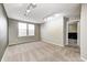 Spacious bedroom with neutral walls, carpet, two windows and modern track lighting at 1229 Tealpoint Cir, Indianapolis, IN 46229