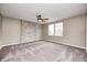 Large bedroom featuring a ceiling fan, brick accent wall, and a large window at 1229 Tealpoint Cir, Indianapolis, IN 46229