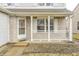 Inviting front porch with classic railings, offering a cozy outdoor seating area and a welcoming entrance at 1229 Tealpoint Cir, Indianapolis, IN 46229