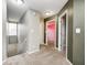 Hallway featuring neutral walls, carpet, and multiple doorways to various rooms at 1229 Tealpoint Cir, Indianapolis, IN 46229