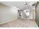 Living room showcasing neutral walls, carpet, and modern track lighting at 1229 Tealpoint Cir, Indianapolis, IN 46229