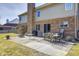 Outdoor dining on a brick patio complements the brick and siding exterior of this two-story home at 1295 Longleaf St, Avon, IN 46123