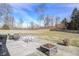 Enjoy outdoor seating and a fire pit on this home's patio within a large grassy backyard at 1295 Longleaf St, Avon, IN 46123