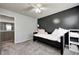 Comfortable bedroom with cozy daybed and a well lit stairwell access to other rooms in the home at 1295 Longleaf St, Avon, IN 46123