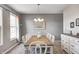 Formal dining room featuring a wooden table with seating for eight and a decorative chandelier at 1295 Longleaf St, Avon, IN 46123
