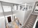 Bright entryway featuring a dark wood door, stylish rug, and a view of the living spaces below at 1295 Longleaf St, Avon, IN 46123