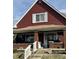 Charming two-story home with a welcoming front porch and beautifully maintained lawn at 1341 N Dearborn St, Indianapolis, IN 46201