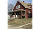Charming two-story home with a welcoming front porch and beautifully maintained lawn at 1341 N Dearborn St, Indianapolis, IN 46201