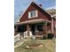 Charming two-story home with a welcoming front porch and beautifully maintained lawn at 1341 N Dearborn St, Indianapolis, IN 46201