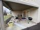 Covered patio with ample seating and room for entertaining overlooking backyard at 1348 Mccormicks Cir, Danville, IN 46122