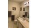 Well-lit bathroom features a large mirror, vanity with sink, and clean, neutral decor at 1348 Mccormicks Cir, Danville, IN 46122